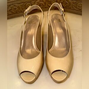 Stewart Weitzman beige tan wedge heels.
